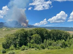 Photo of Squirrel and Mill Creeks in Gunnison County with a smoke plume