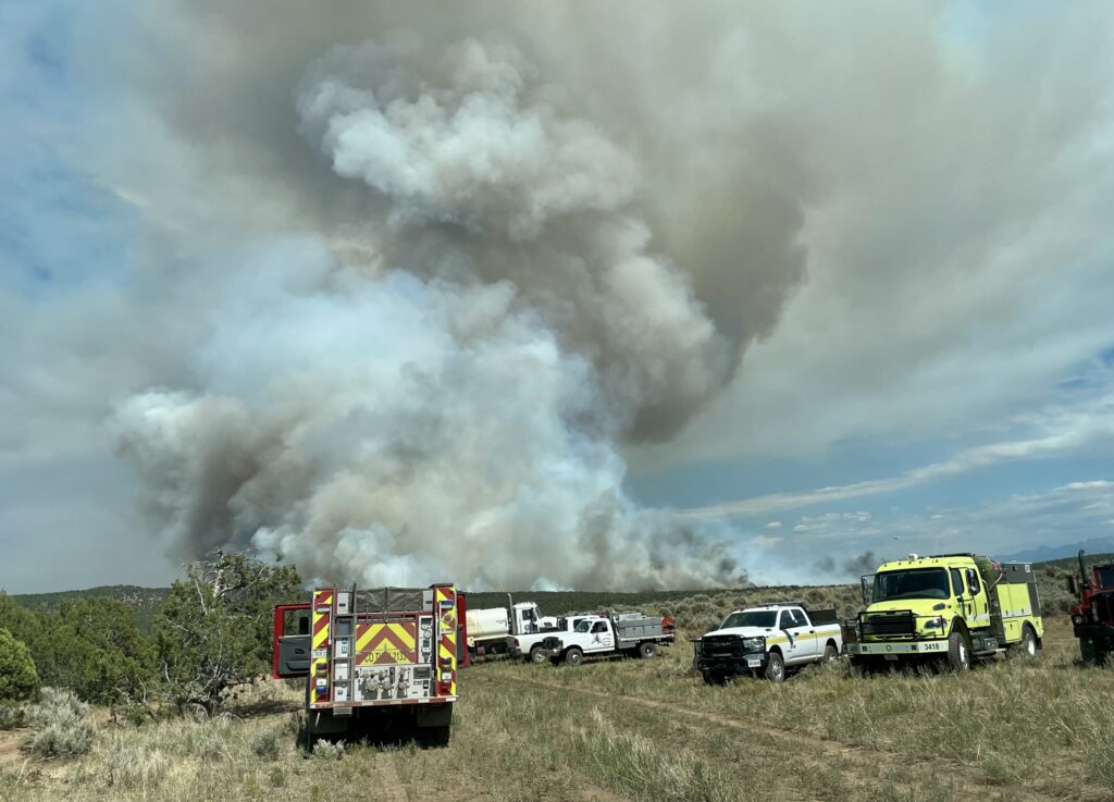 Emergency Vehicles parked in a field